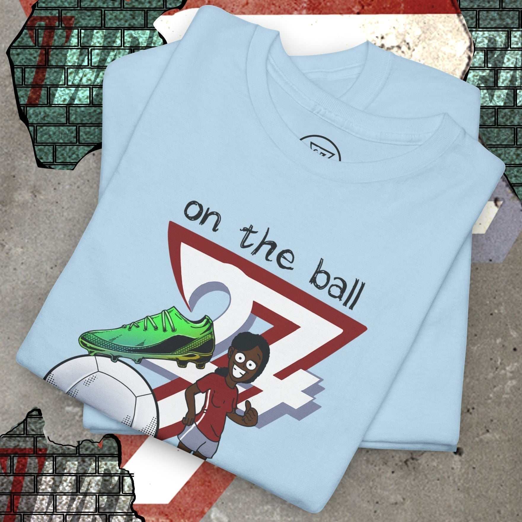 Light blue women's football boot tee with hand-drawn soccer boot and player graphic, soft cotton fabric.