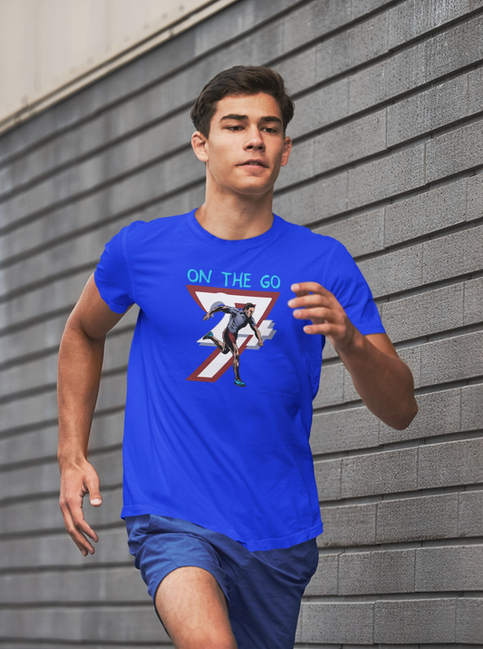 Male runner wearing a blue running T-shirt with a hand-drawn comic-style runner illustration and "ON THE GO" text, jogging outdoors.