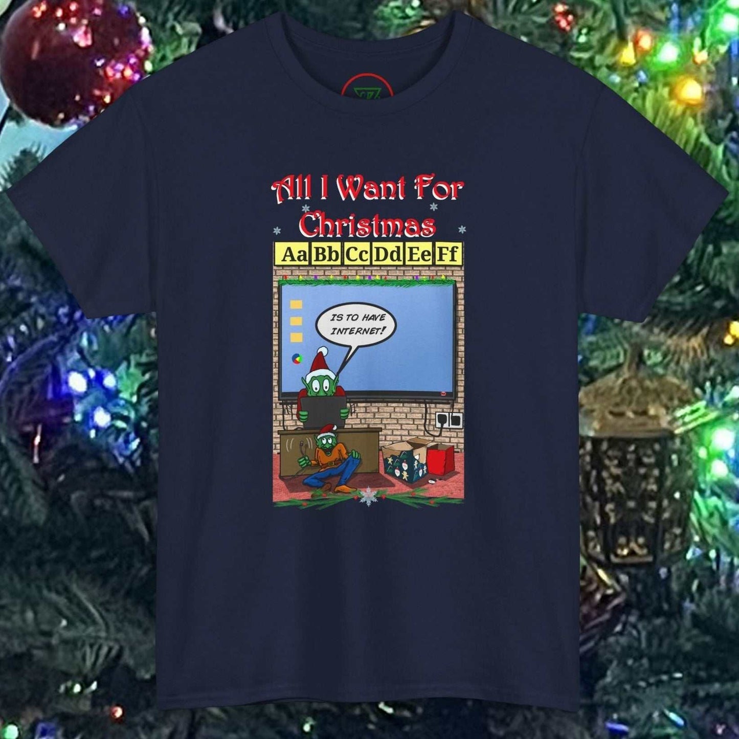 Navy Teacher Elf T-Shirt with cartoon elf and Christmas classroom design against Christmas tree background
