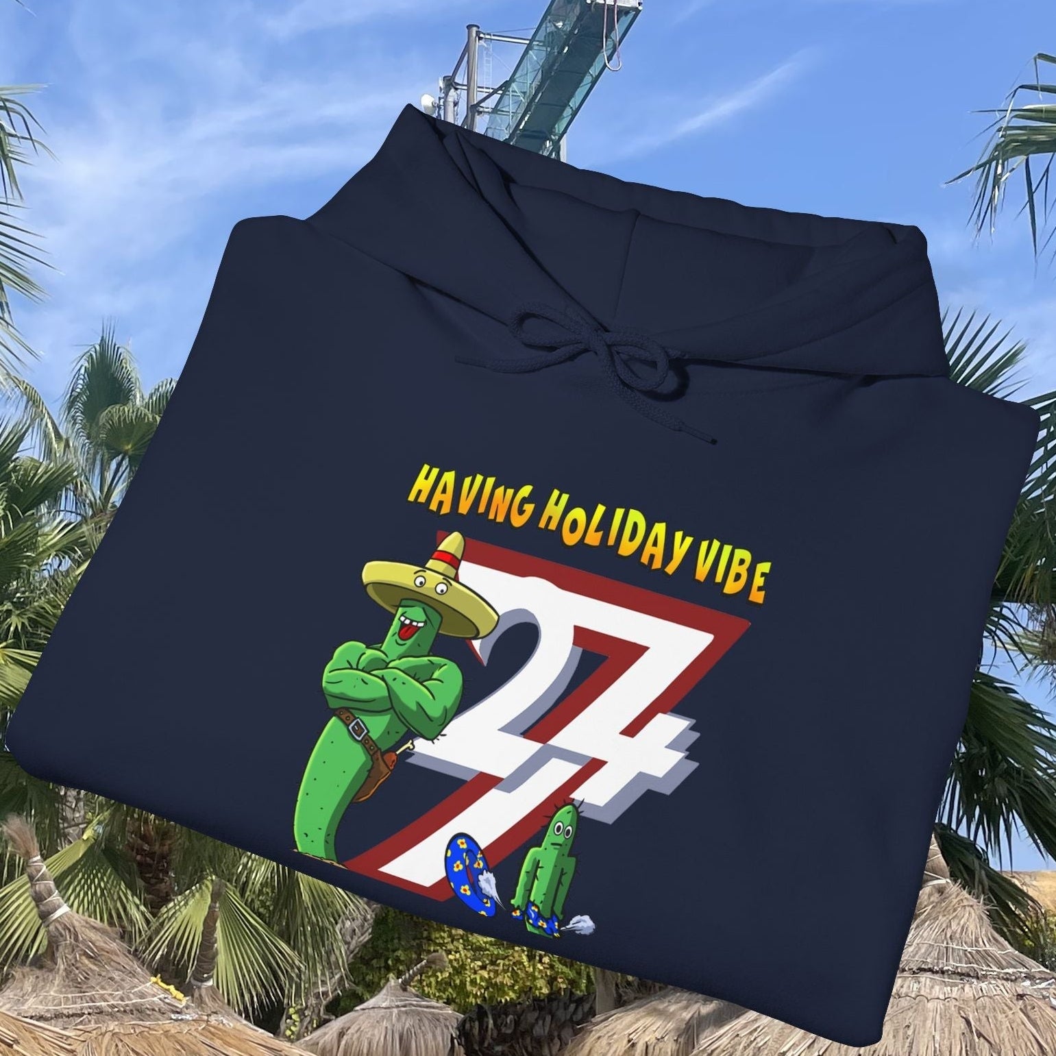 Navy cactus hoodie with cartoon holiday vibe design featuring cactus character wearing sombrero and number 24/7 graphic