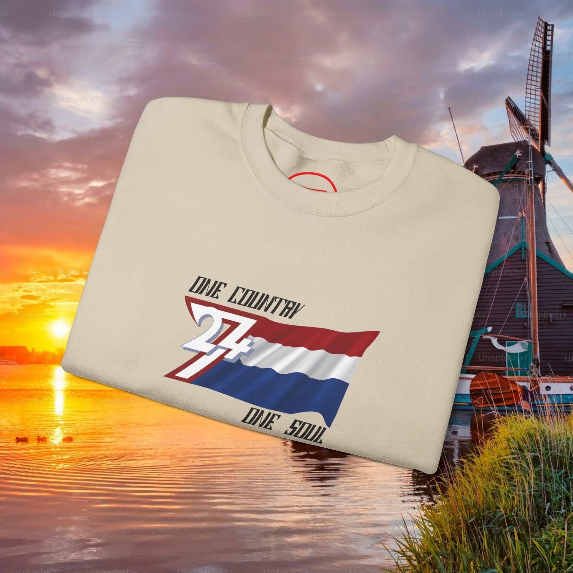 Netherlands Flag Sweatshirt with hand-drawn vibrant red, white, and blue design saying "One Country One Soul" on cream crewneck background