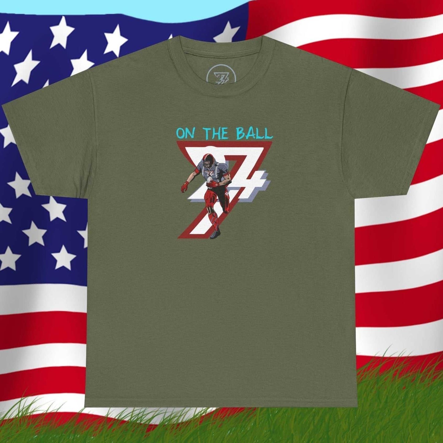 Olive green American football tee with hand-drawn comic-style player graphic and "On The Ball" text on chest
