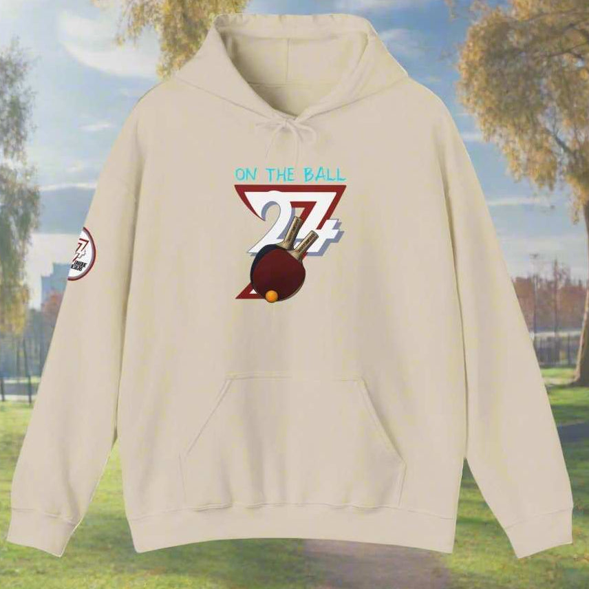 Beige ping pong hoodie with hand-drawn design and kangaroo pocket, made from cotton-polyester blend.