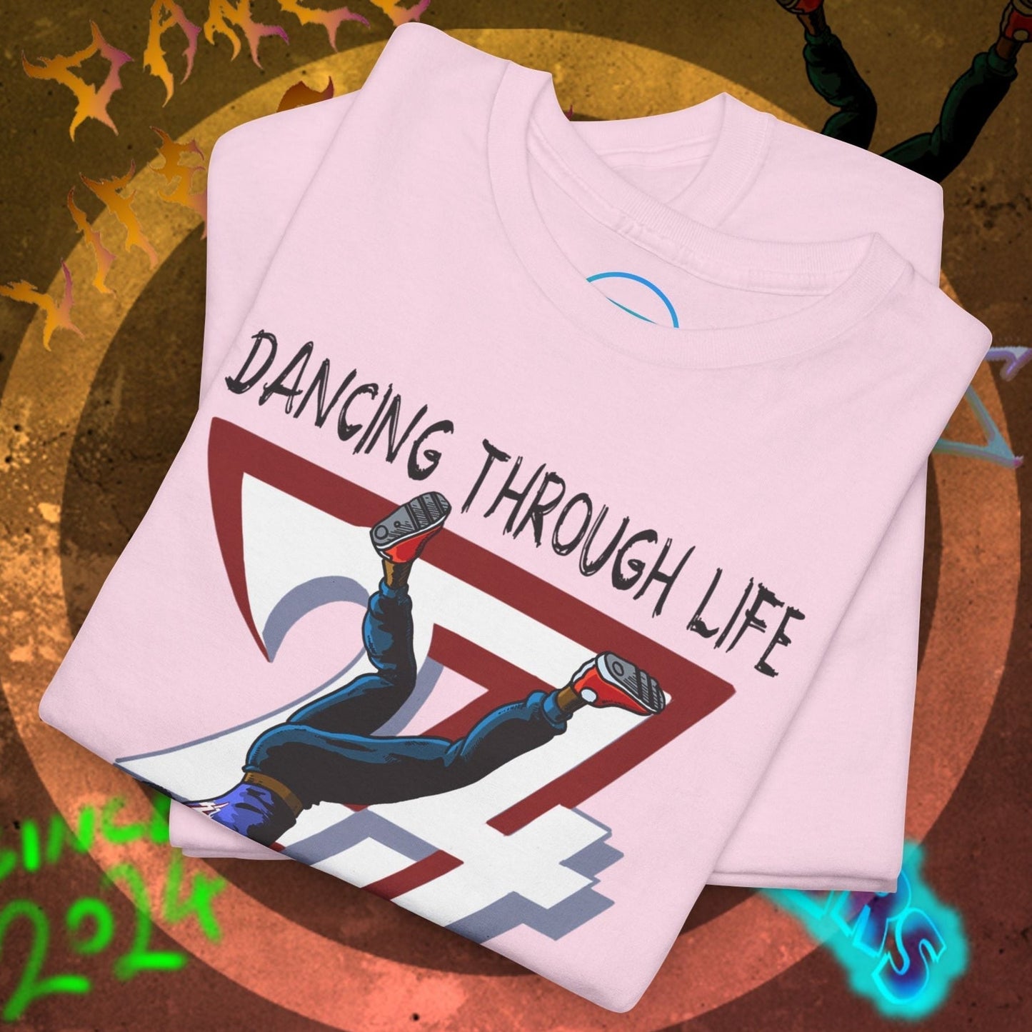 Pink dance tee with "Dancing Through Life" graphic and hip-hop streetwear style