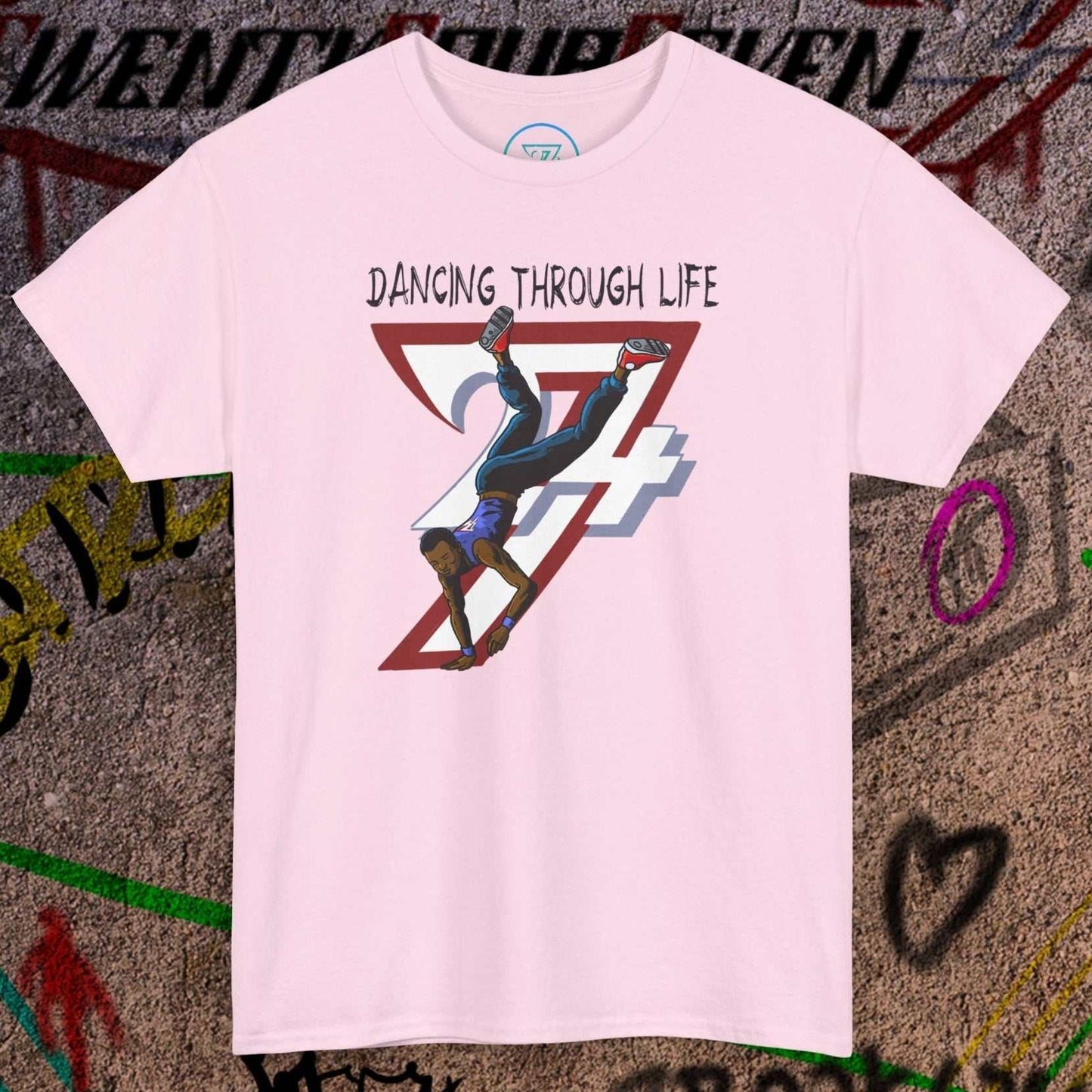 Pink dance tee with comic-style hip-hop dancer graphic and "Dancing Through Life" text