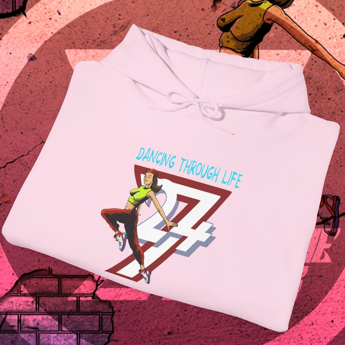 Pink street dance hoodie for women with colorful dancing girl illustration and "Dancing Through Life" text, urban casual style