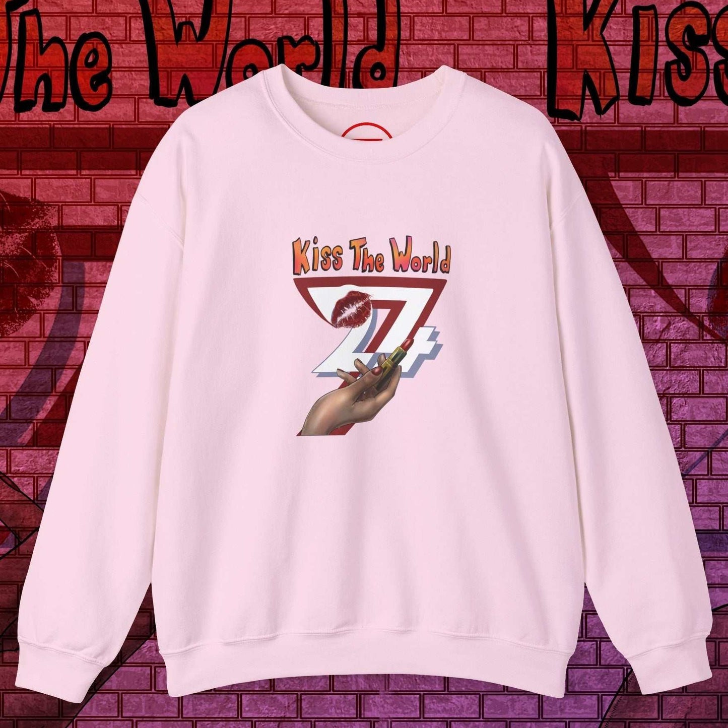 Pink sweatshirt for women with bold lipstick design and "Kiss The World" text by 24/7 Unique Designs