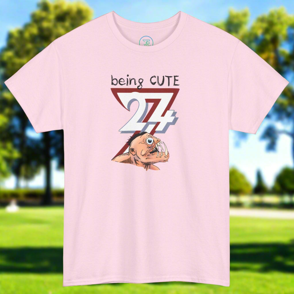 Pink t-shirt with funny monster face cartoon and "being cute 24/7" text design