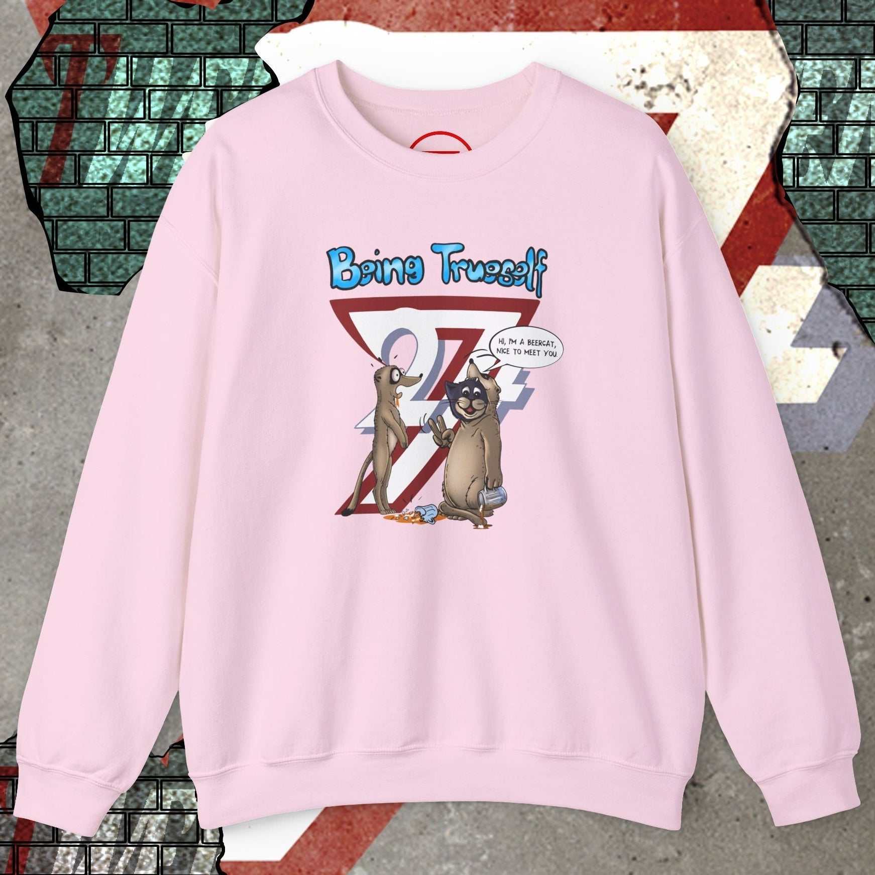 Pink unisex sweatshirt featuring cat and meerkat cartoon with "Being Trueself 24/7" slogan front design