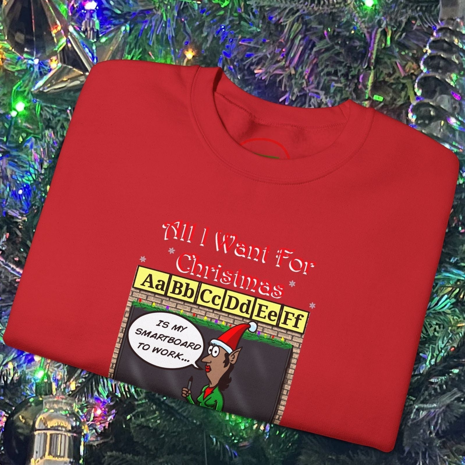 Red Christmas Teacher Comic Sweatshirt with funny cartoon teacher and holiday message displayed on a Christmas tree background