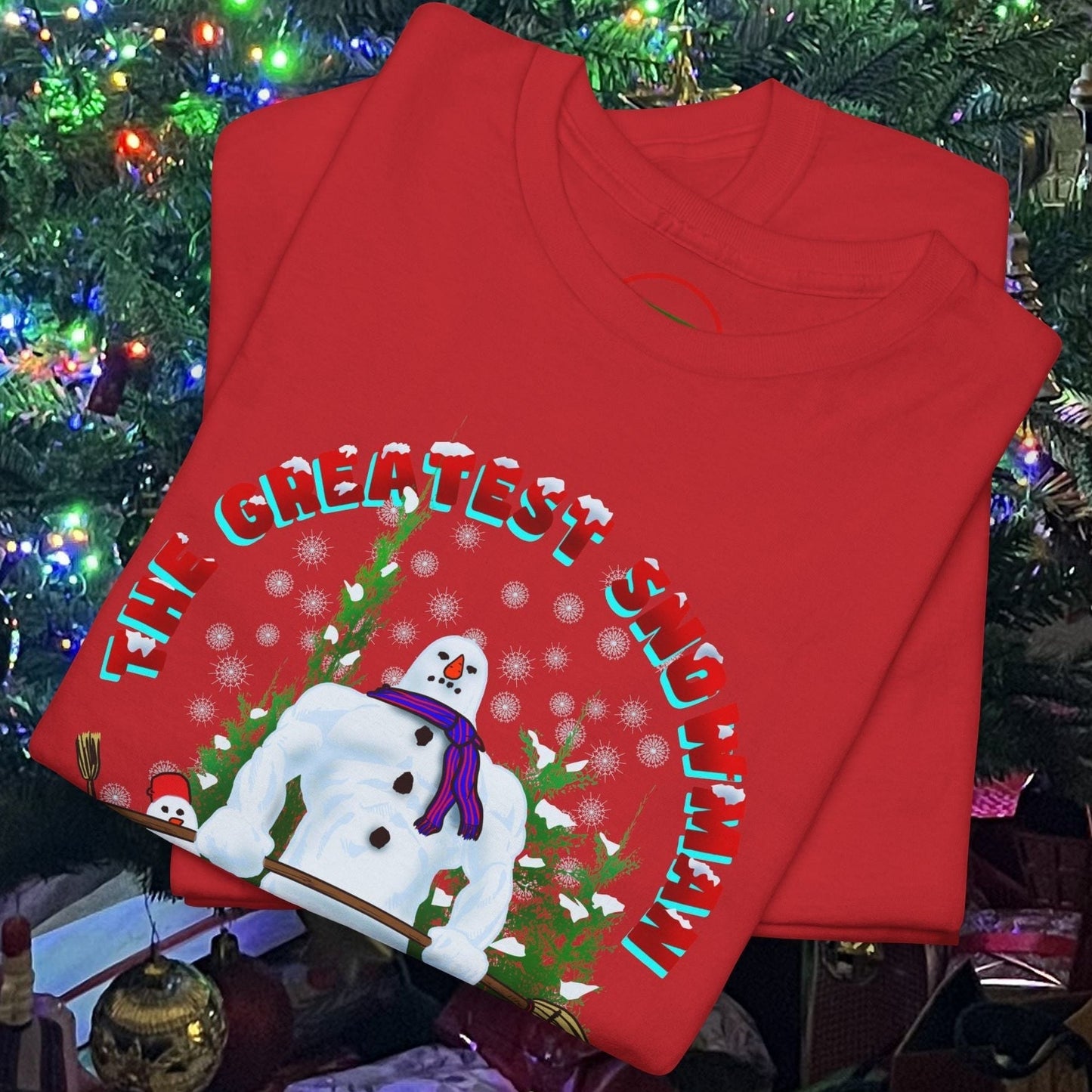 Red Greatest Snowman Gym T-Shirt with a cartoon snowman lifting dumbbells under a decorated Christmas tree background