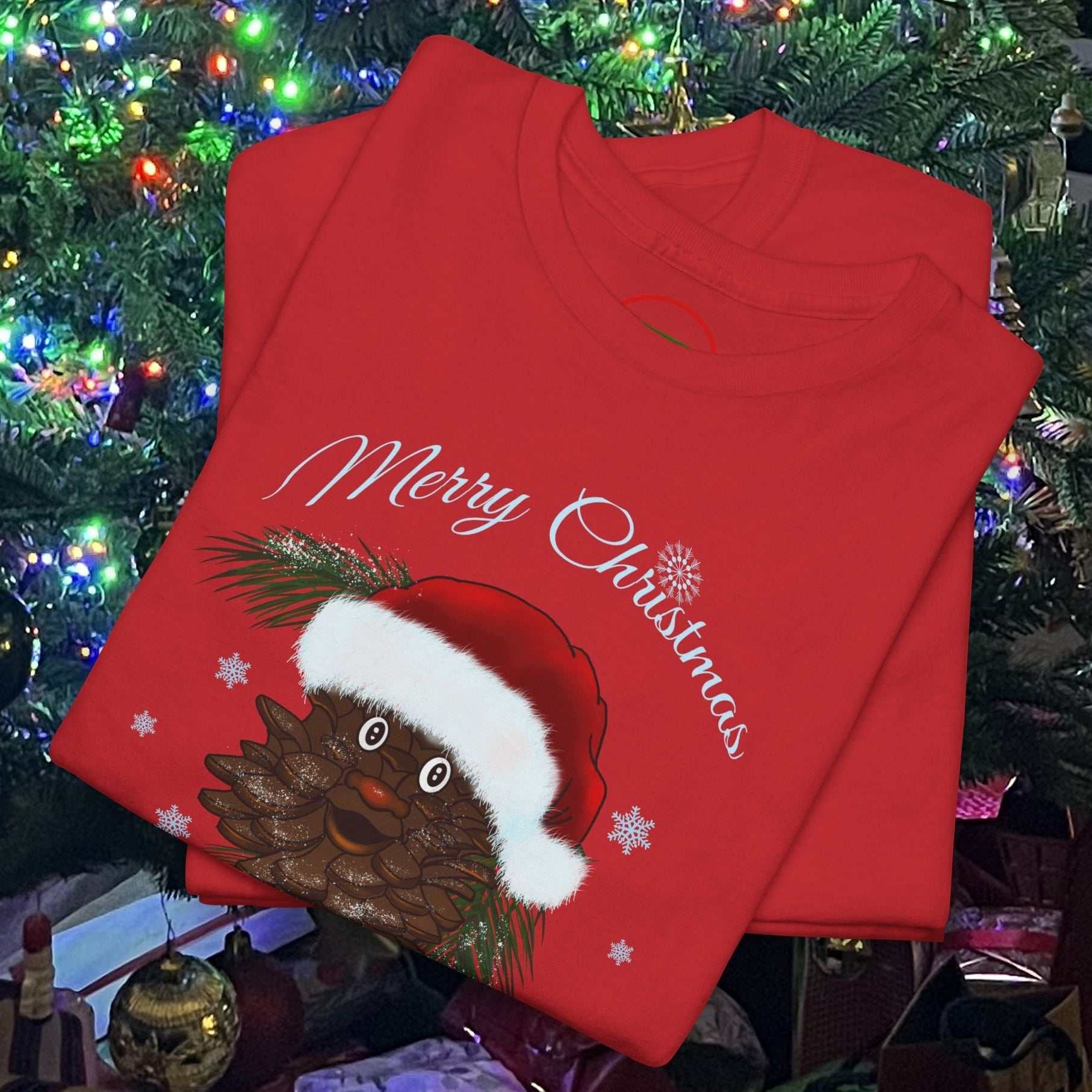 Red Santa Pinecone Tee with cartoon pinecone wearing Santa hat and "Merry Christmas" text on festive background