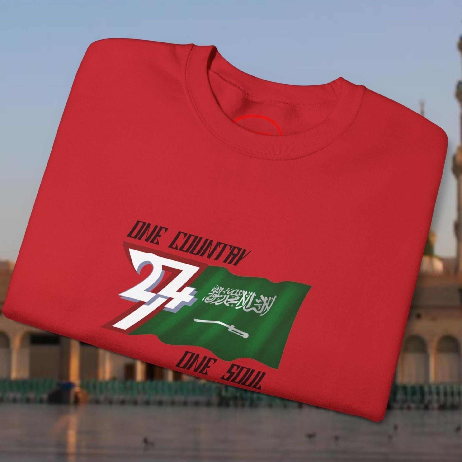 Red Saudi Arabia Flag crewneck sweatshirt with vibrant hand-drawn flag design and "One Country One Soul" text on front