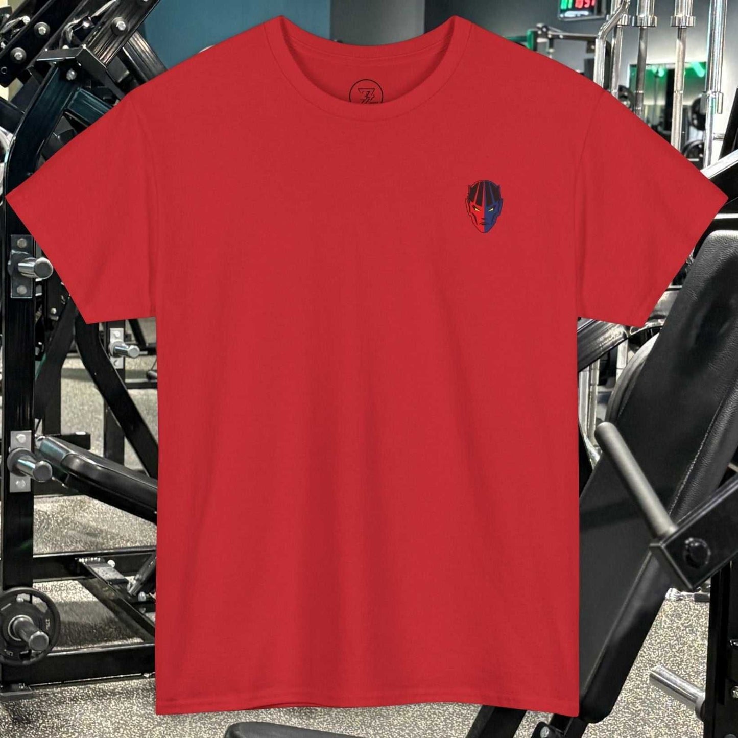 Red bodybuilding tee with hand-drawn comic-style fitness character graphic in gym setting