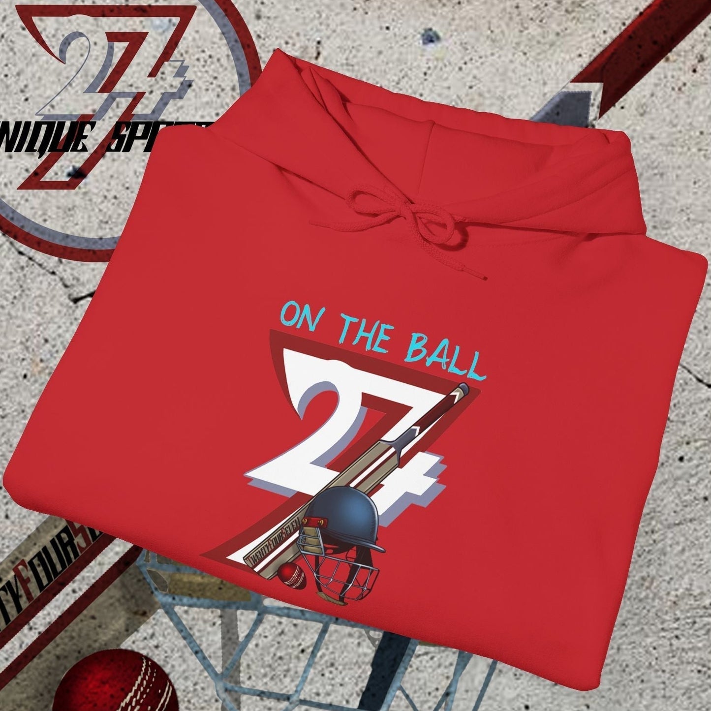 Red cricket hoodie sweatshirt with unique cricket bat, ball, and helmet illustration and "On the Ball 24/7" text design