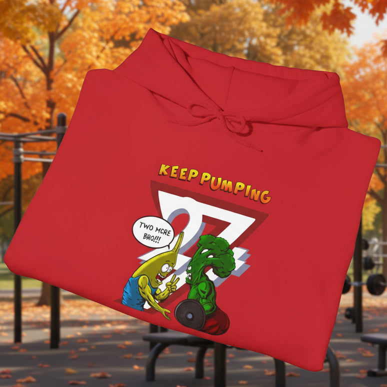 Red workout hoodie with cartoon broccoli and banana characters and "Keep Pumping" text design