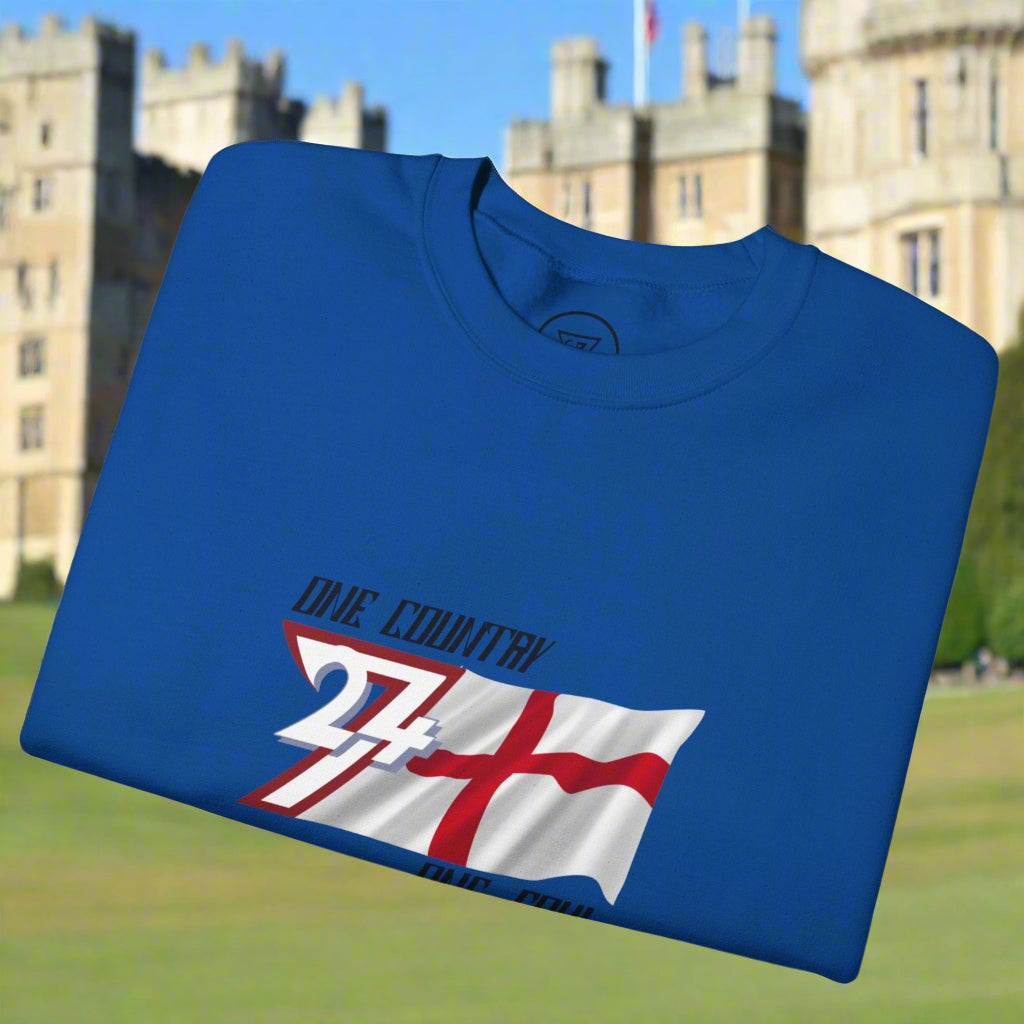 Blue England sweatshirt with unique England flag and "One Country One Soul" slogan design, folded outdoors.