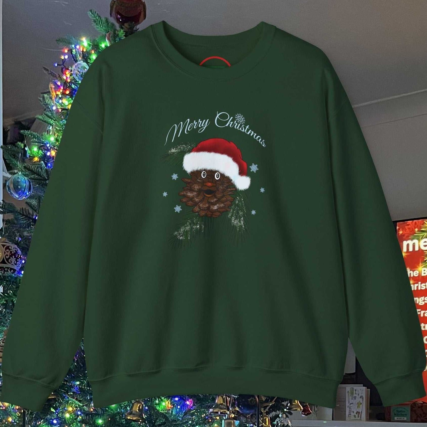 Santa Pinecone Christmas Sweatshirt with hand-drawn pinecone wearing Santa hat on green unisex crewneck.