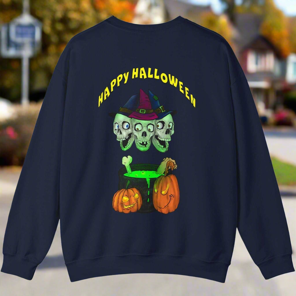 Halloween sweatshirt with three skulls wearing a witch hat above a bubbling green cauldron and two pumpkins, navy blue crewneck style