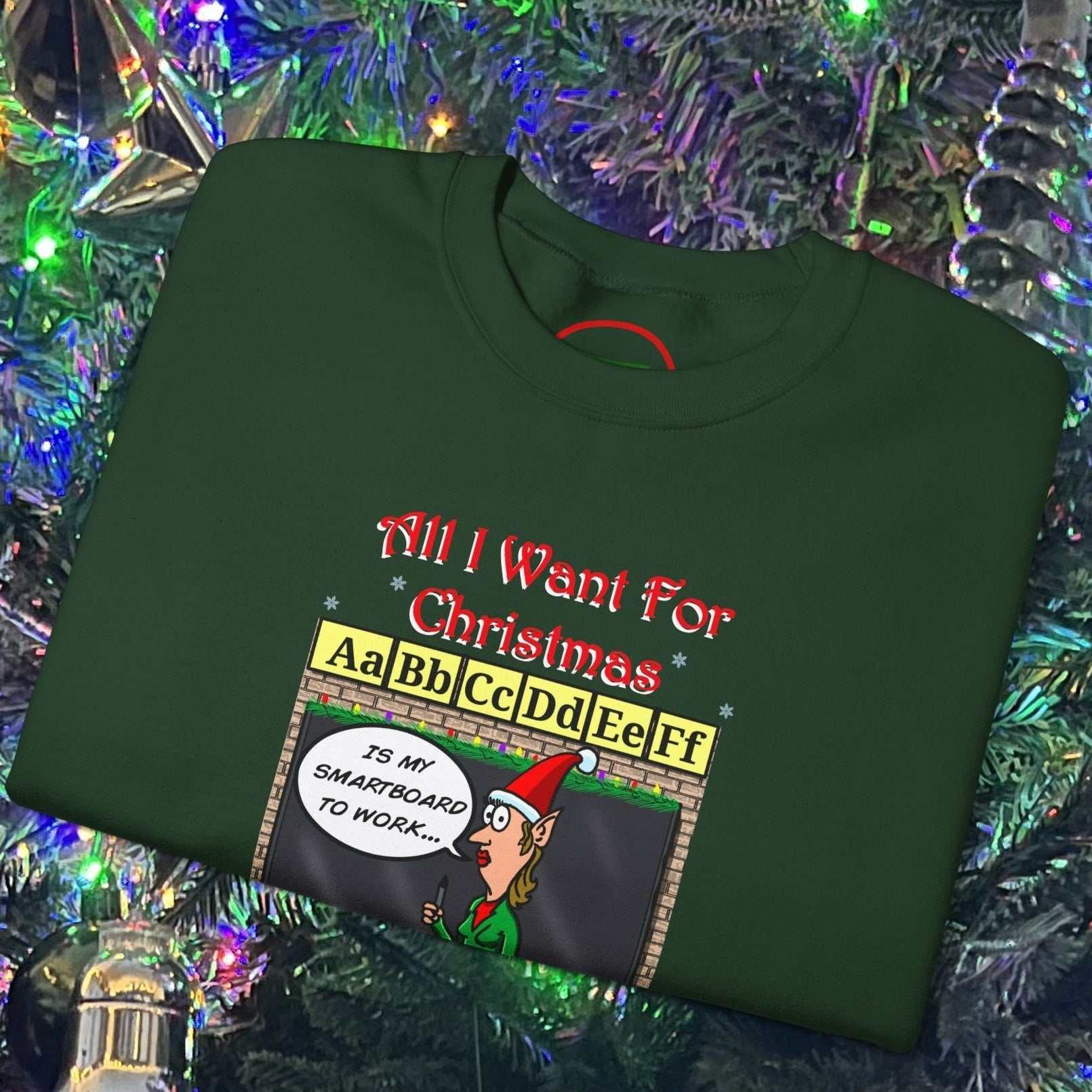 Teacher Christmas sweatshirt with funny cartoon comic design, green cotton-poly blend, holiday-themed teacher gift.