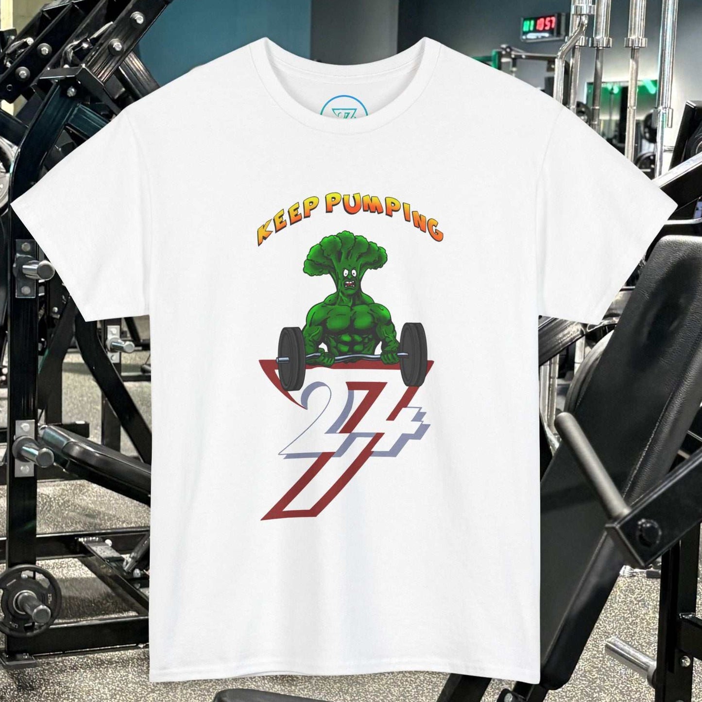 White Broccoli Weightlifting Cartoon T-Shirt with "Keep Pumping" text and muscular broccoli graphic lifting weights in gym setting