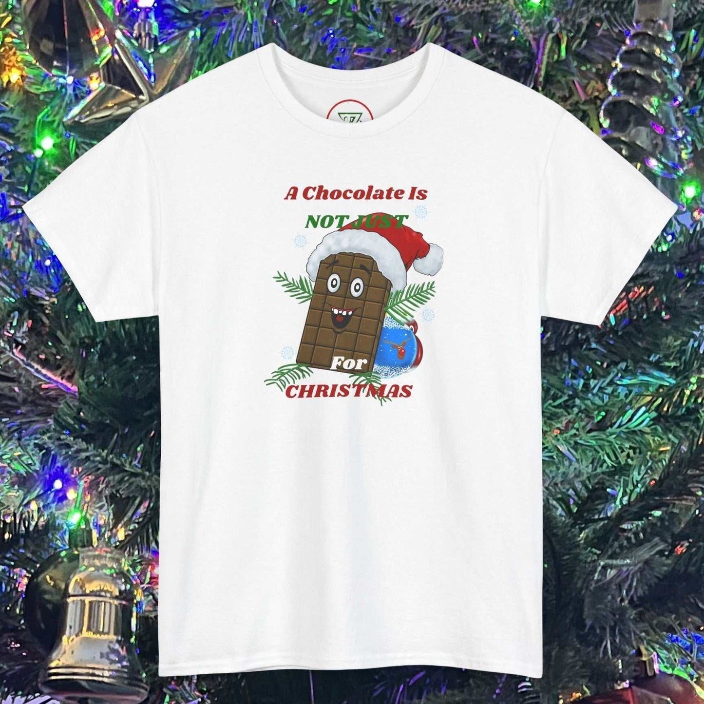 White Christmas t-shirt featuring a cartoon chocolate bar wearing a Santa hat with festive text design