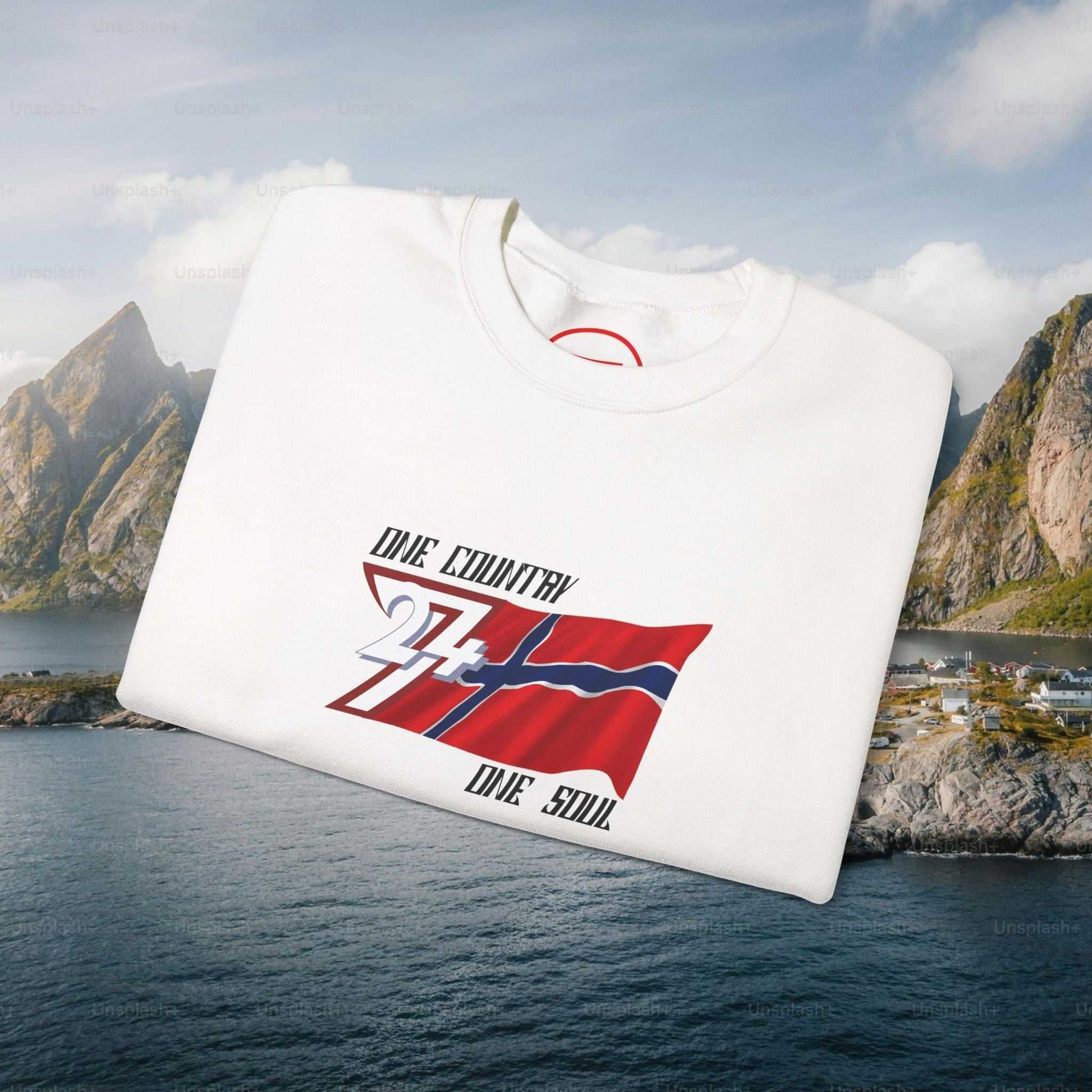 White Norway Flag Crewneck Sweatshirt with hand-drawn flag illustration folded on scenic Norwegian fjord background