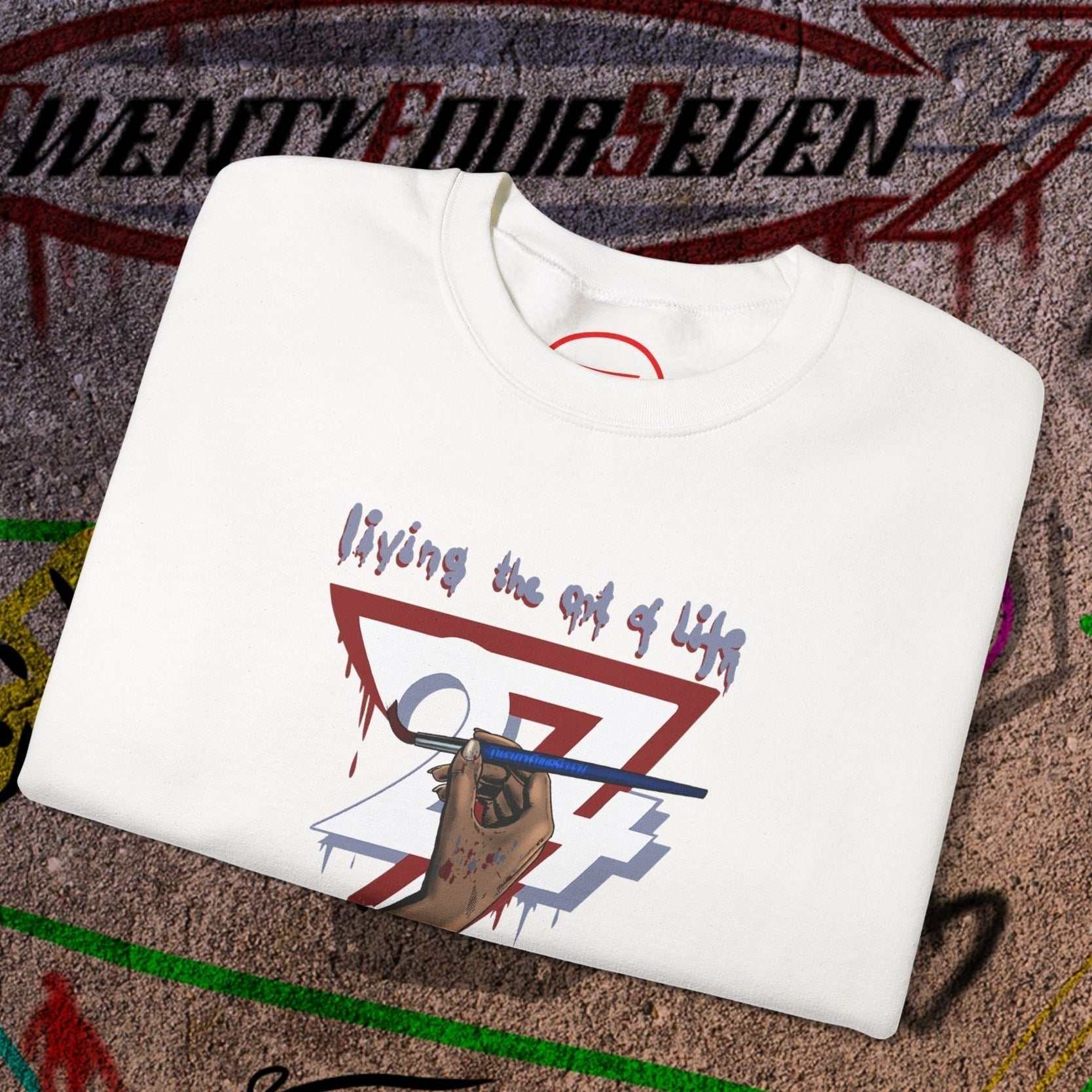 White artist brush sweatshirt with hand-drawn "living the art of life" design and creative graphic elements