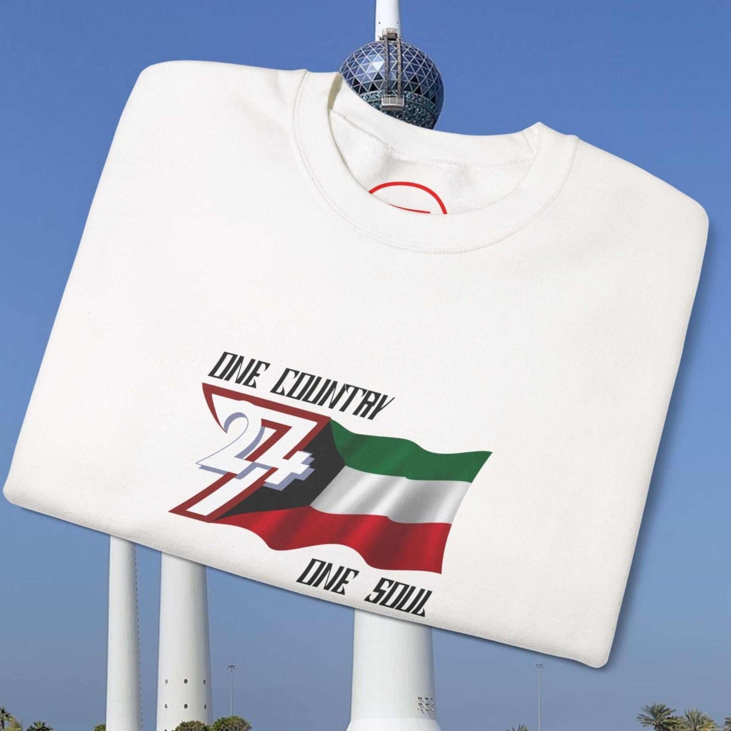 White crewneck jumper with hand-drawn vibrant Kuwait flag illustration and "One Country One Soul" text