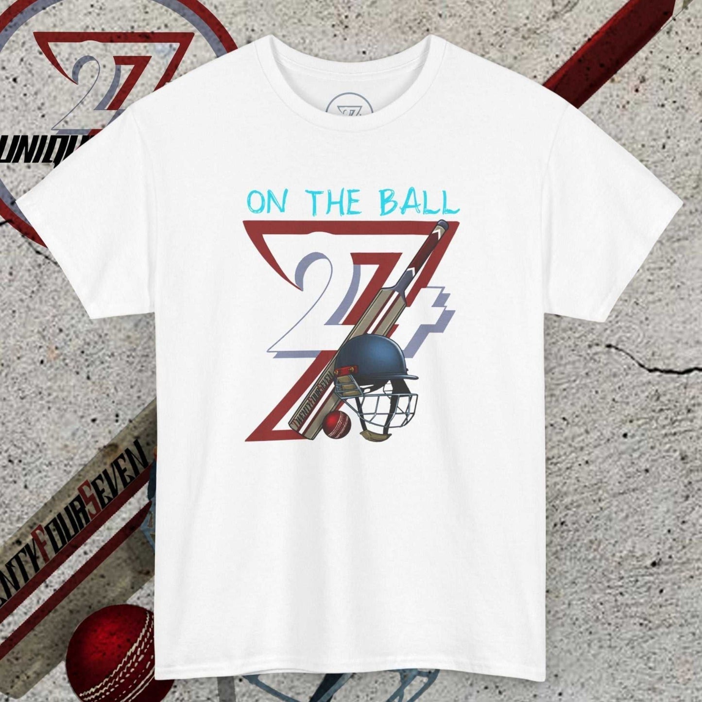 White cricket tee with hand-drawn 90s style cricket bat, ball, and helmet illustration and "On The Ball" text