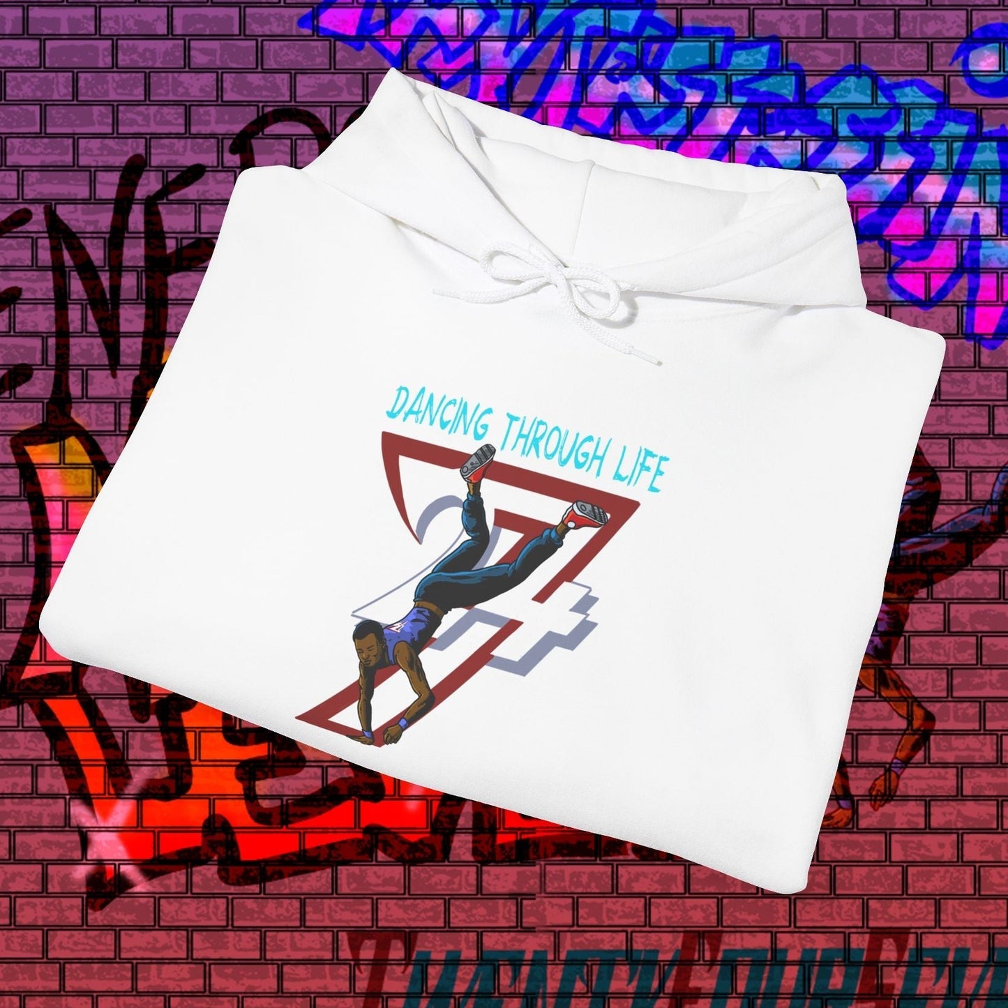 White street dance hoodie with hand-drawn dancer illustration and "Dancing Through Life" text against urban graffiti background