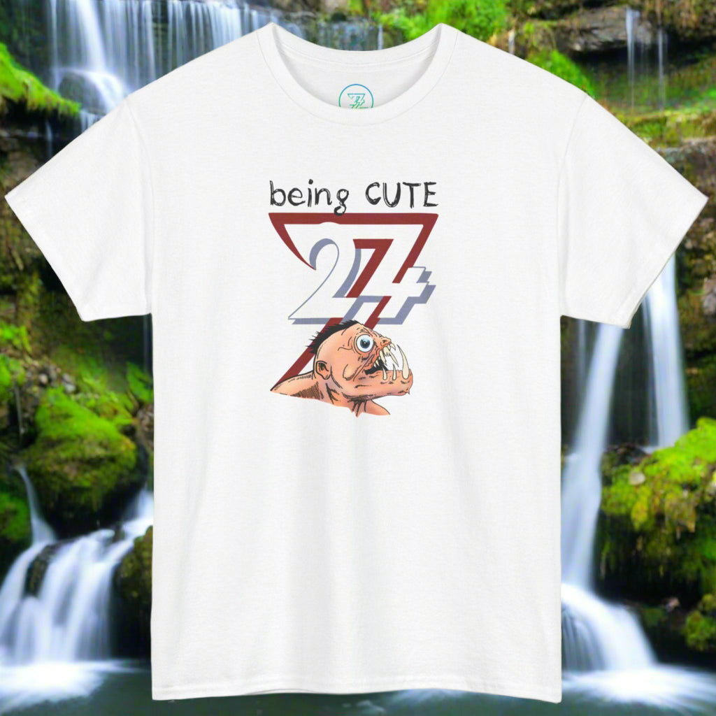 White t-shirt with a funny monster face cartoon and "being CUTE 27" text design