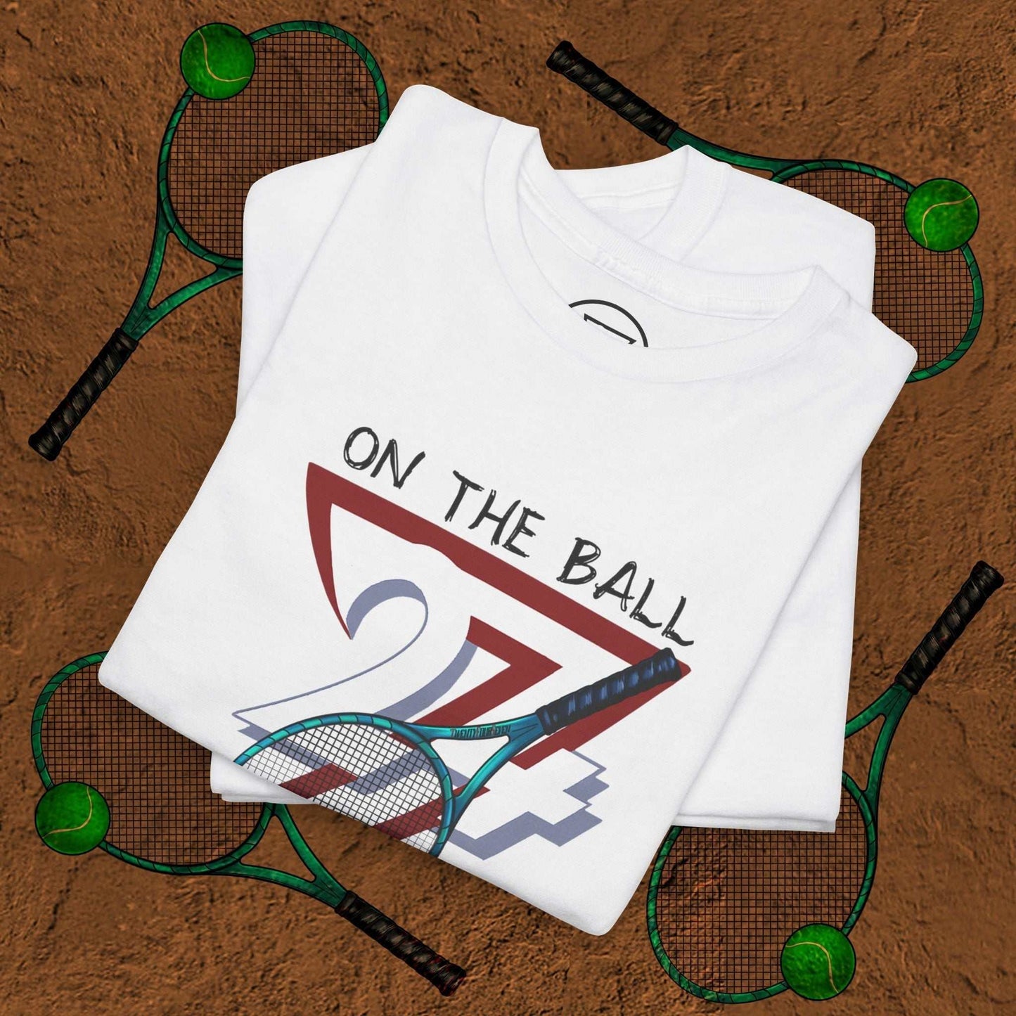 White tennis tee with "On the Ball 24/7" hand-drawn graphic and tennis racquet design