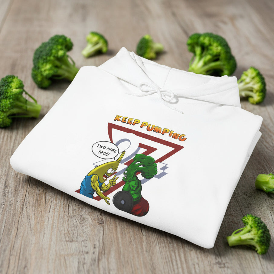White workout hoodie with cartoon broccoli and banana illustration and "Keep Pumping" text