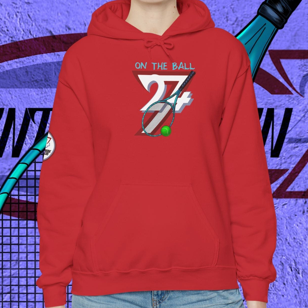 Woman wearing red tennis hoodie with hand-drawn tennis gear design and kangaroo pocket