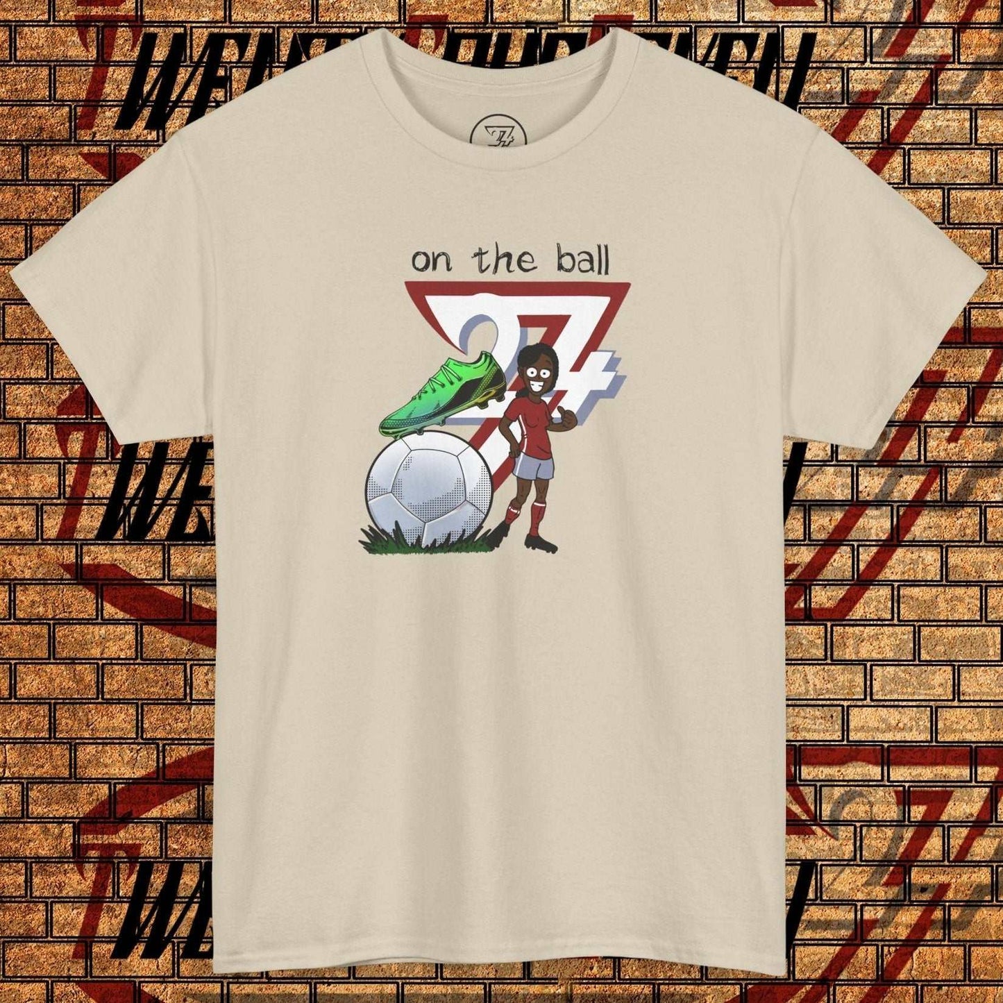 Women's football boot tee with hand-drawn soccer boot and ball graphic on beige cotton shirt