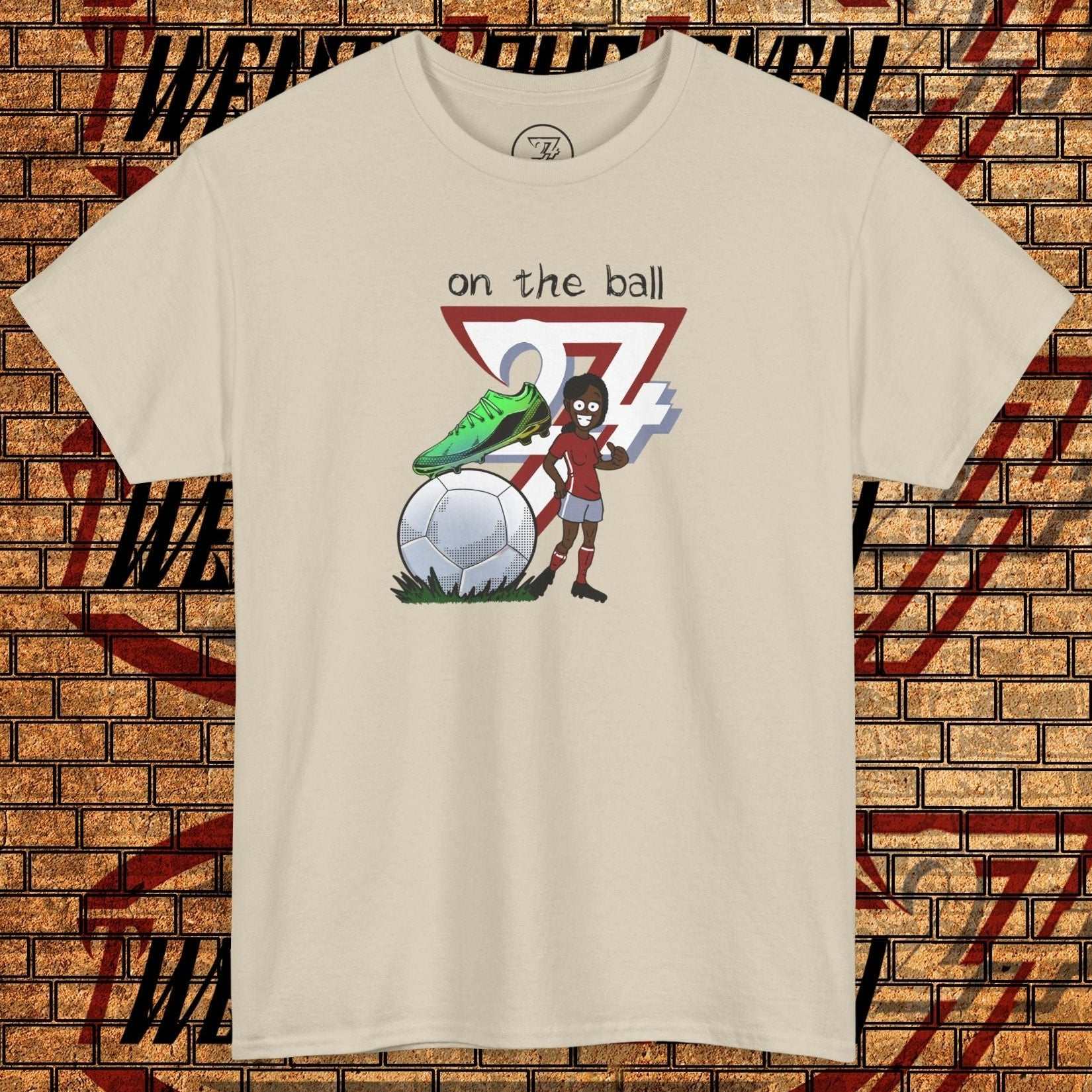 Women's football boot tee with hand-drawn soccer boot and ball graphic on beige cotton shirt