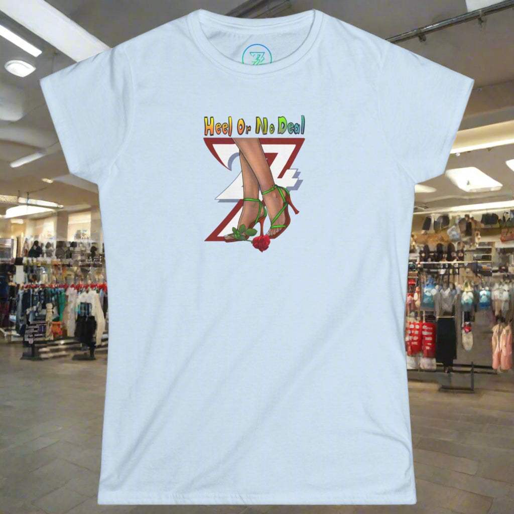 Women's light blue graphic tee with "Heel or No Deal" quote, roses, and high heels illustration