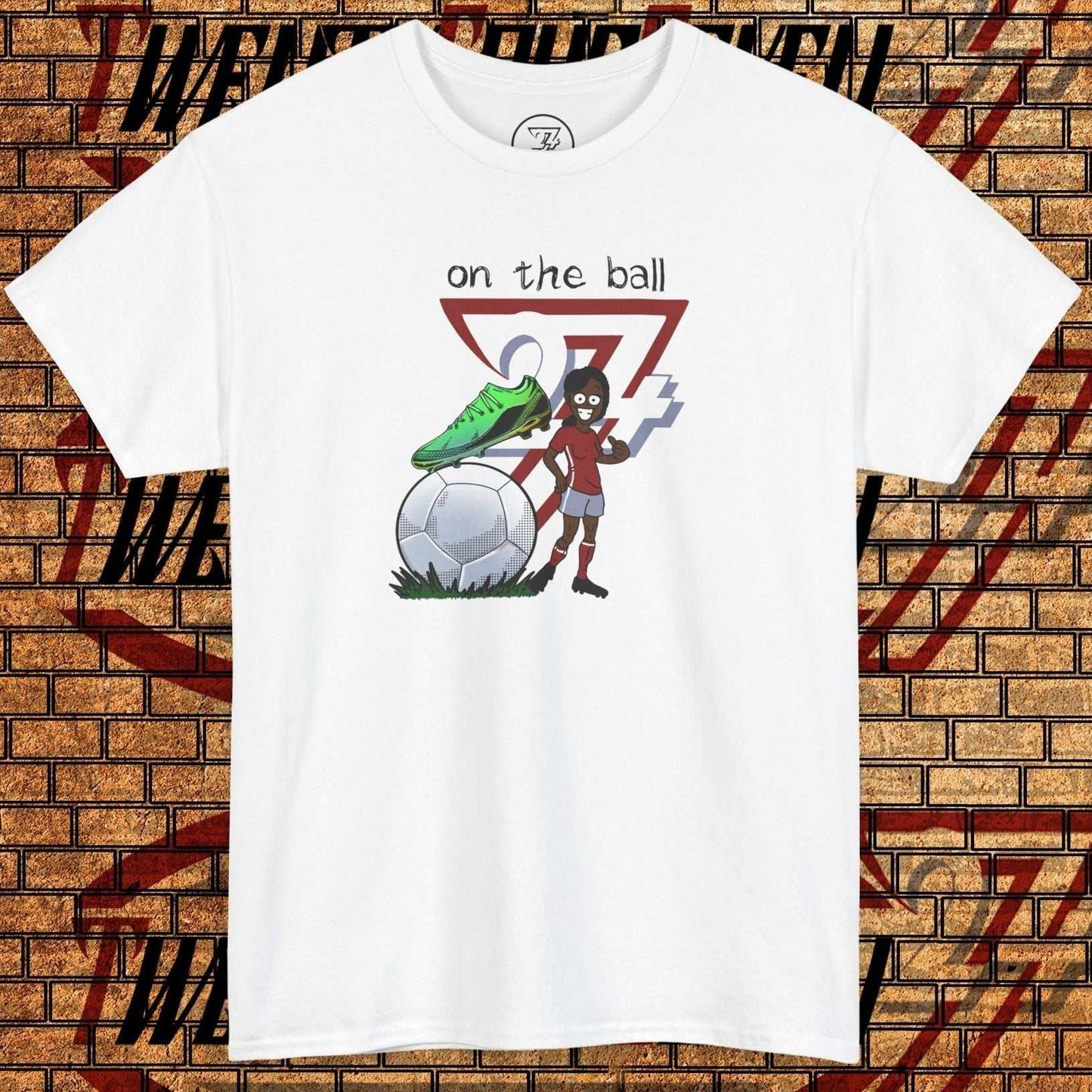 Women's white football boot tee with hand-drawn soccer boot graphic and "on the ball" text