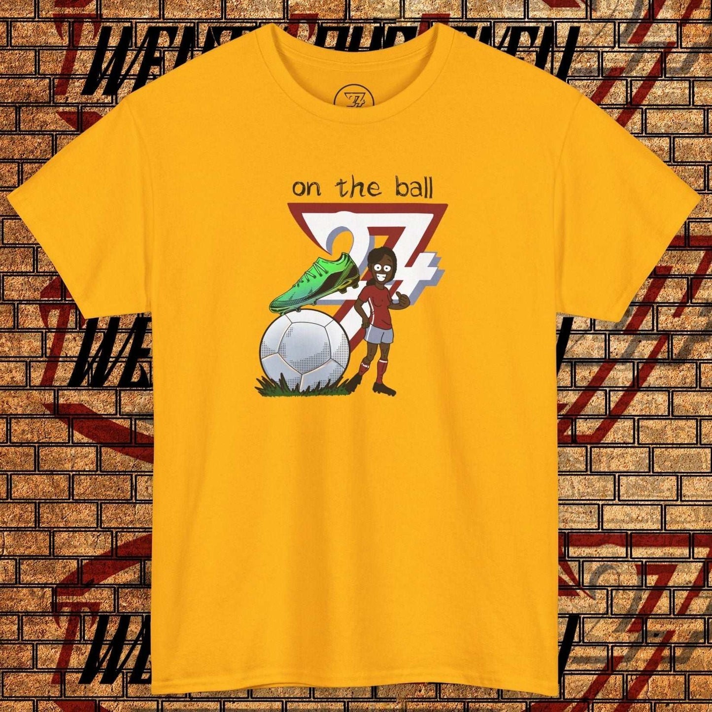 Women's yellow football boot tee with hand-drawn soccer boot graphic and text "on the ball"
