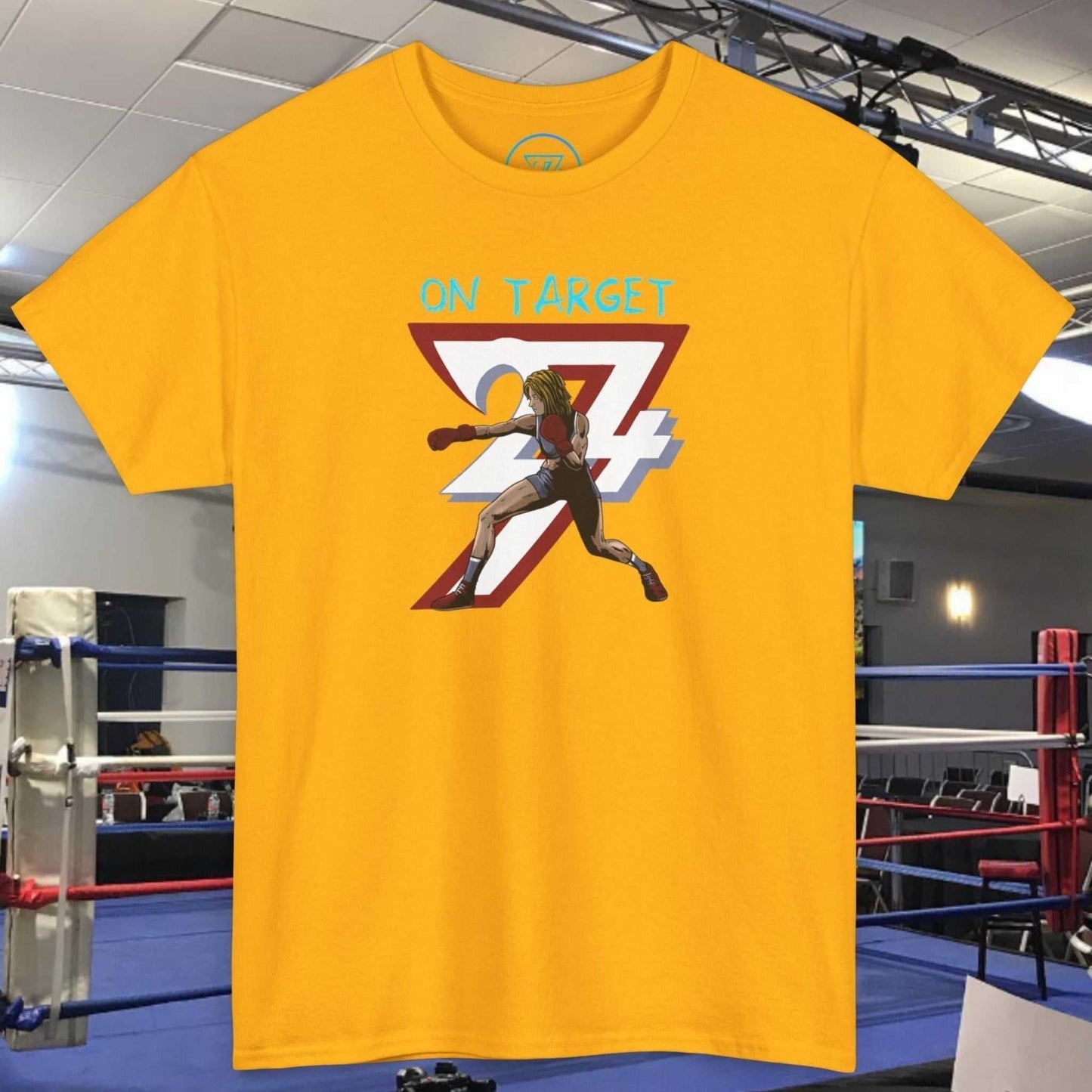 Yellow Boxer Girl T-Shirt with hand-drawn boxing girl graphic and "ON TARGET 24" text, set in a boxing ring environment
