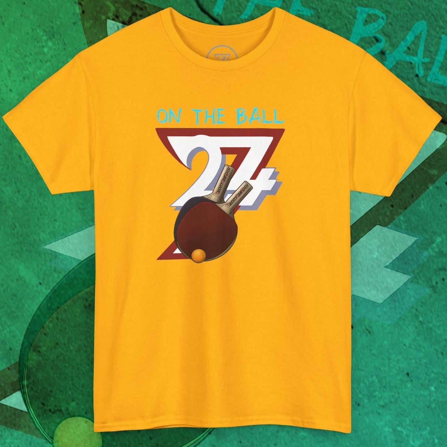 Yellow Ping-Pong T-Shirt with hand-drawn paddles and "ON THE BALL 24/7" text design