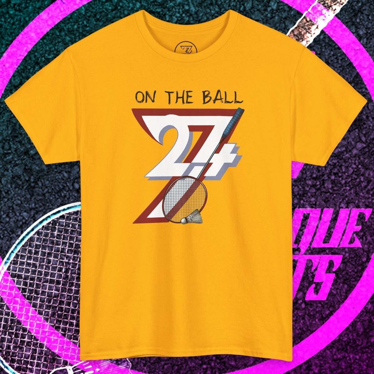 Yellow badminton tee with hand-drawn "On the Ball" graphic, breathable cotton, and classic fit for training and casual play