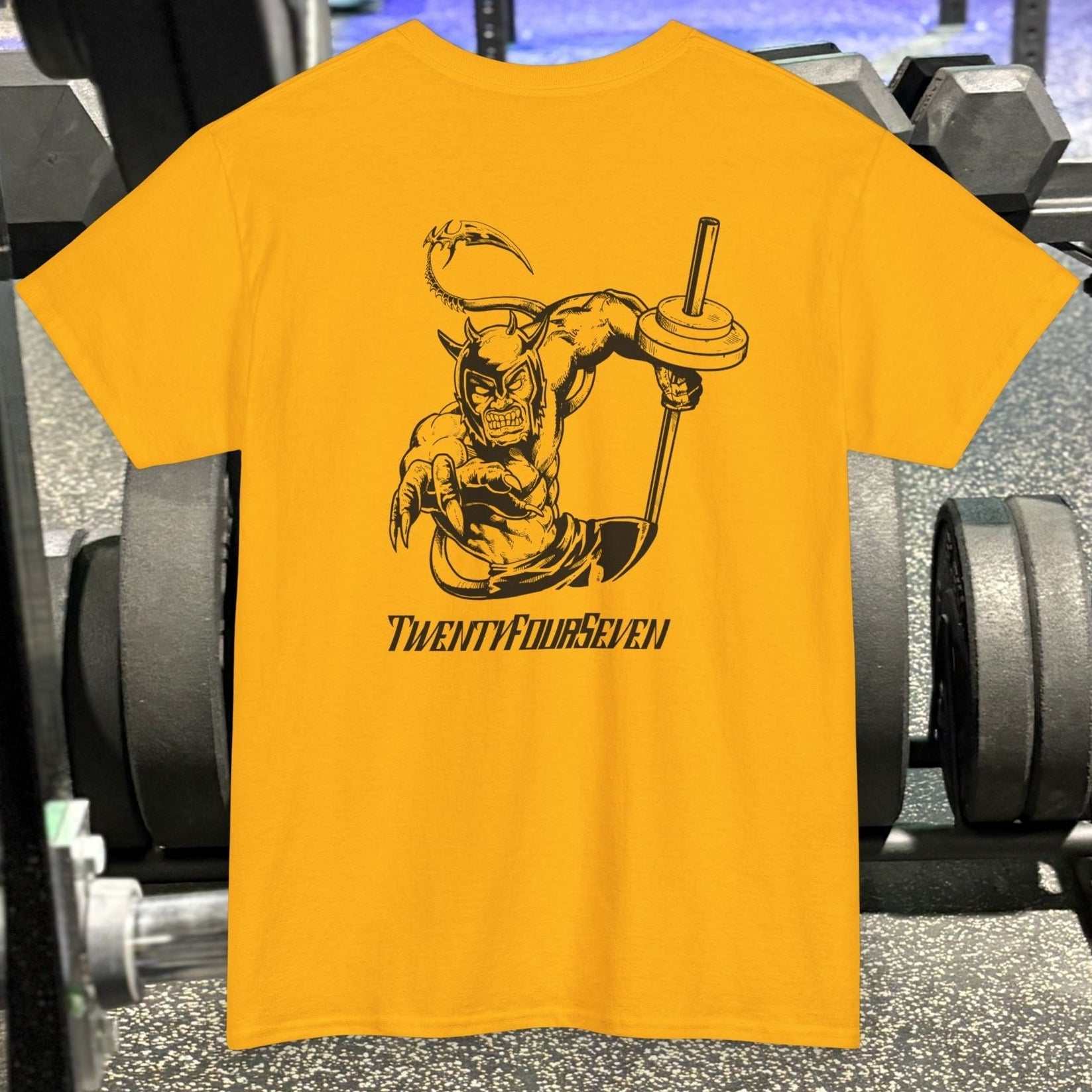 Yellow bodybuilding tee with hand-drawn comic-style muscular character lifting weights and "TWENTYFOURSEVEN" text design on back