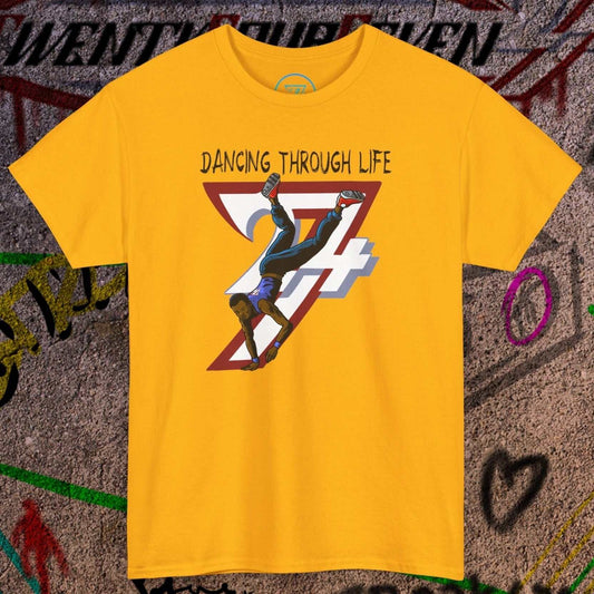 Yellow dance tee with urban streetwear graphic of a dancer doing a handstand and text "Dancing Through Life" in comic style