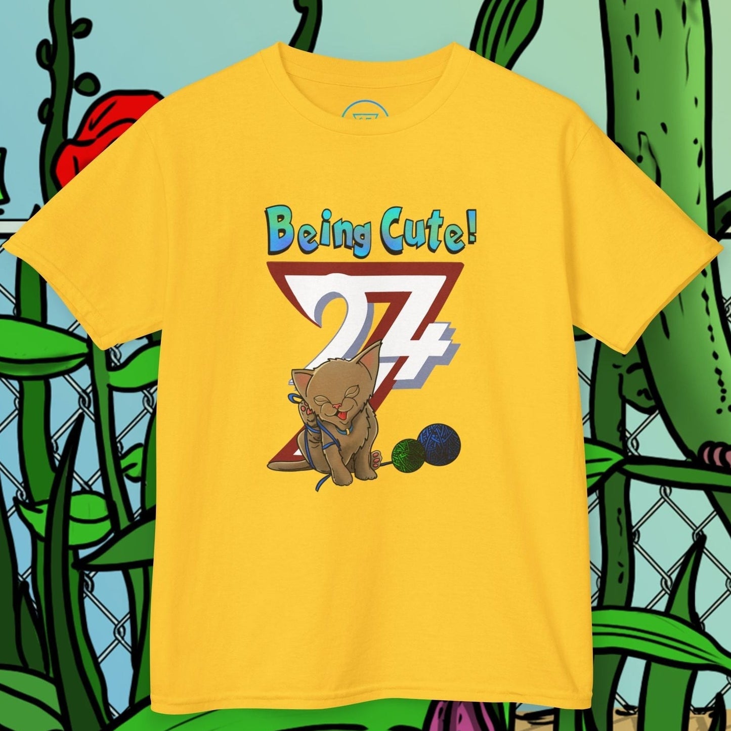 Yellow kids cat t-shirt with hand-drawn cute kitten and playful text "Being Cute!" on front