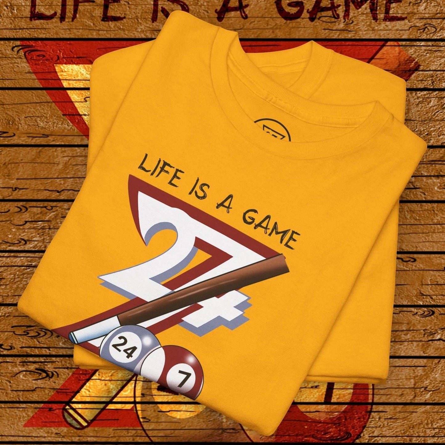 Yellow pool tee with hand-drawn "Life is a Game" billiards design featuring cue stick and balls.