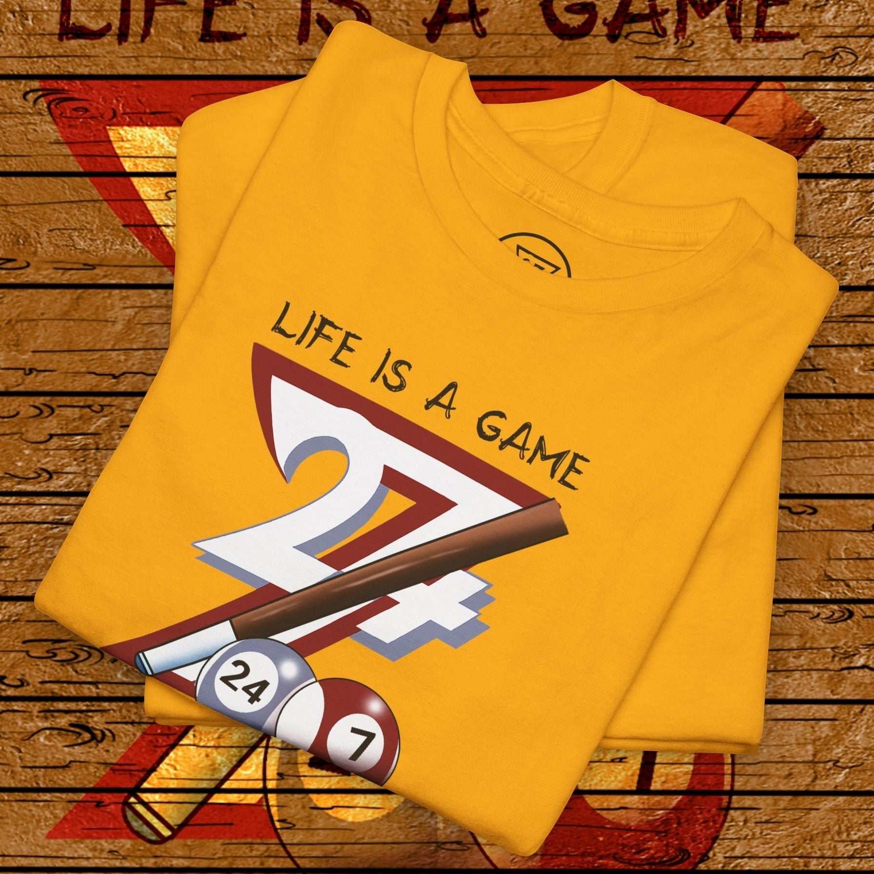 Yellow pool tee with hand-drawn "Life is a Game" billiards design featuring cue stick and balls.