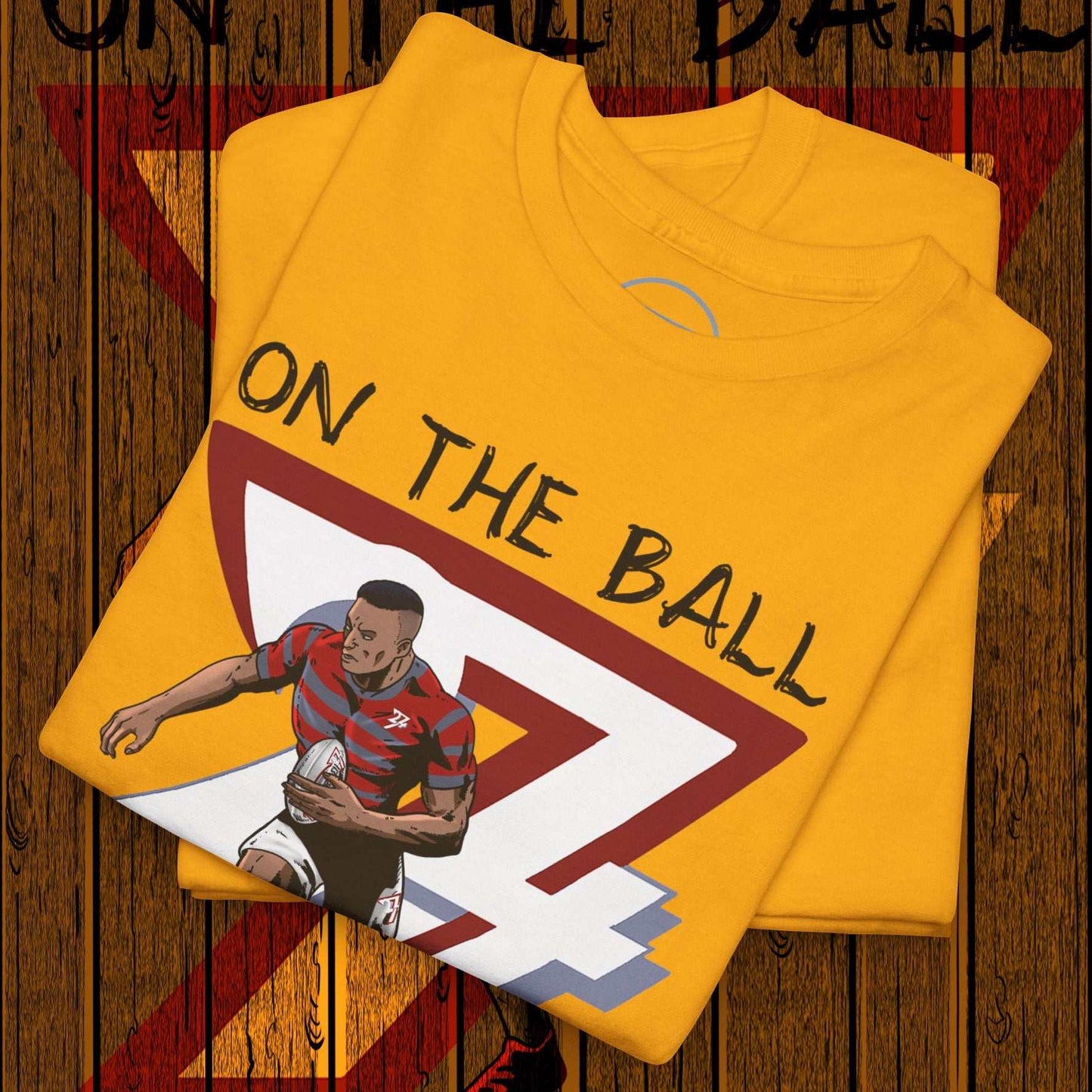 Yellow rugby sports tee with hand-drawn rugby player and "On The Ball" text design