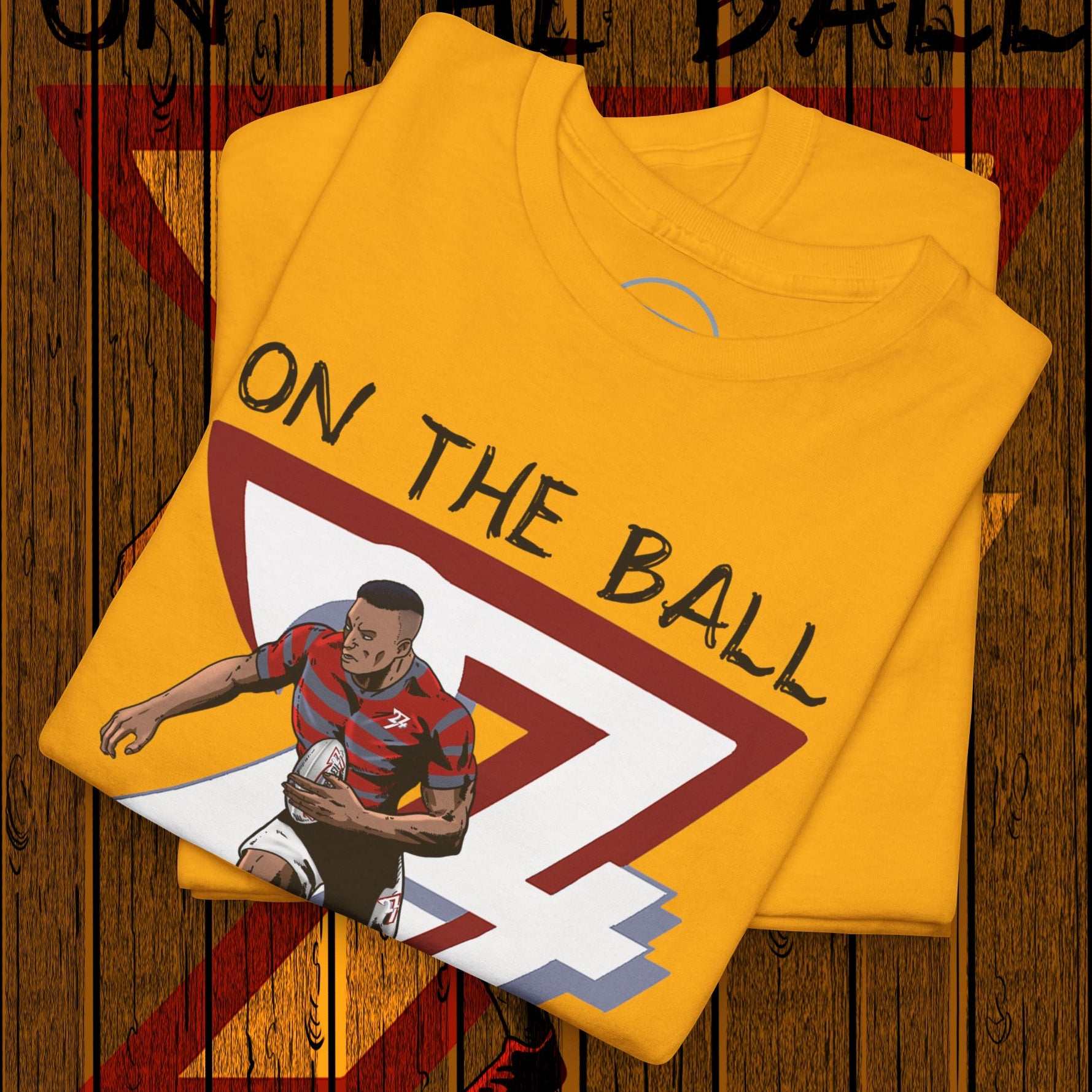 Yellow rugby sports tee with hand-drawn rugby player and "On The Ball" text design